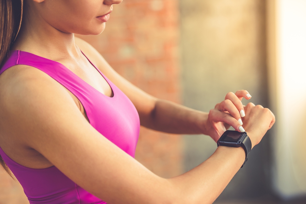 Woman tracking fitness with a Fitbit