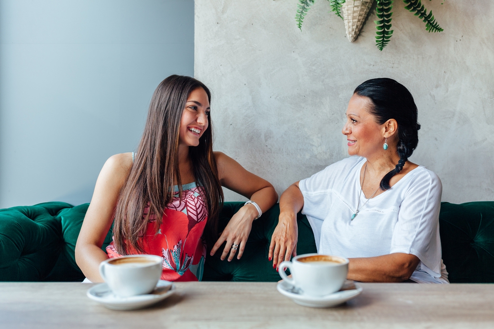 Mother and daughter having a coffee together