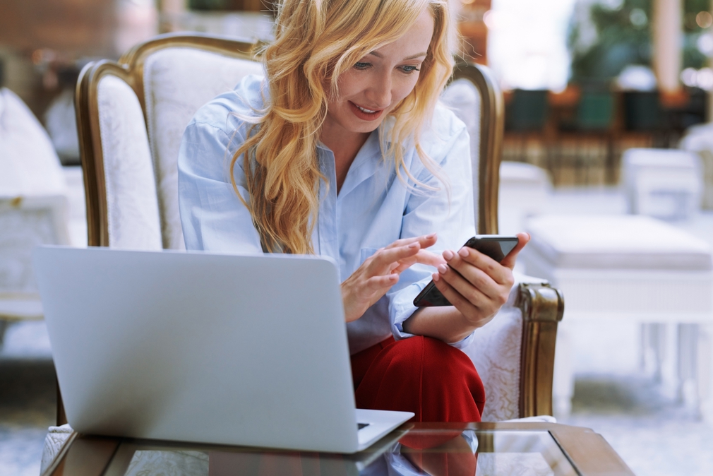 Woman red pants on phone