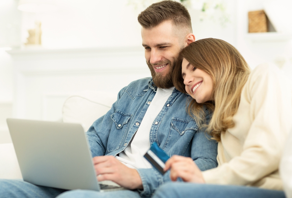Young couple online shopping together