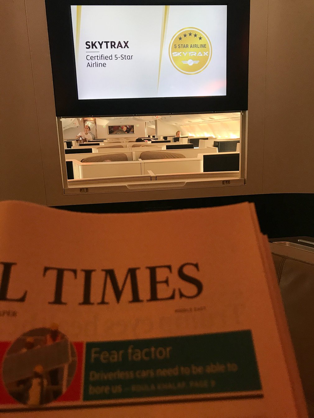 Reading the Financial Times in the business class bar & lounge
